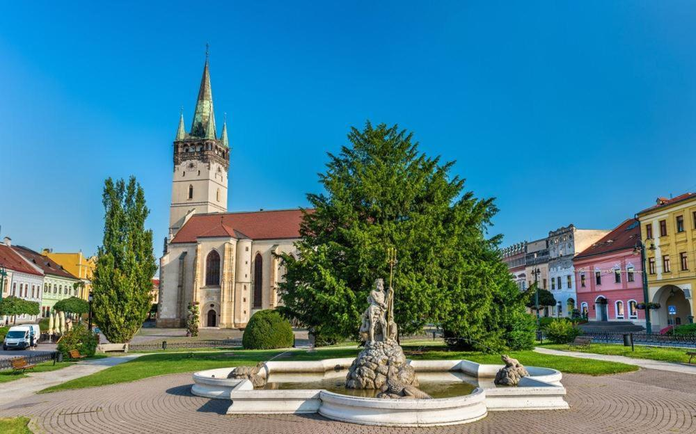 Main square surrounded by historic buildings in Prešov, Slovakia.
