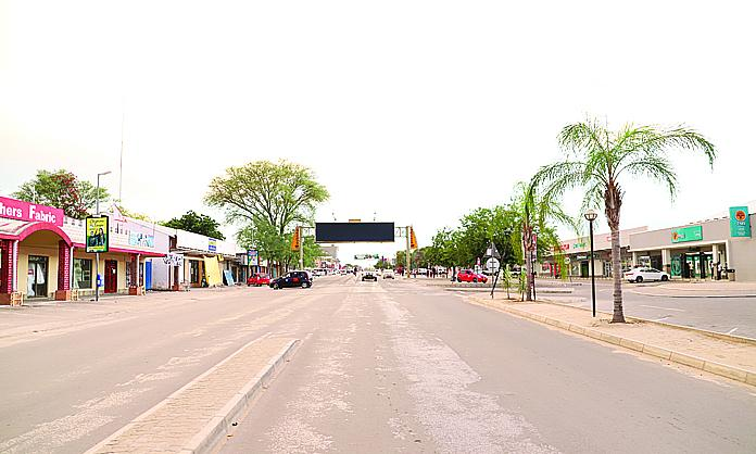 Visitors walking through streets in Rundu with local markets, shops, and pedestrian activity.