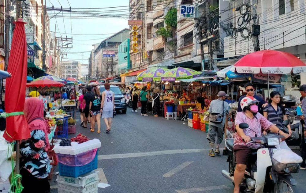 Visitors exploring Kim Yong Market in Hat Yai, Thailand, a bustling marketplace and tourist attraction.